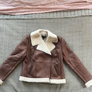 Idyllwind Faux Brown Leather Jacket. Faux shearling lining. Zip front closure